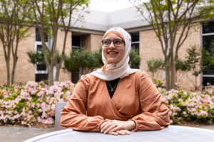 Mennah Abdelwahab poses for a portrait in the Instructional Plaza outside the Grady College of Journalism and Mass Communication.